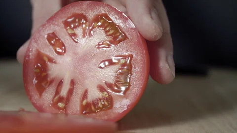 Macro wide close up of knife slicing and chopping a red tomato salad, food, Stock Footage 273512229