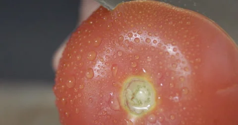 Macro wide close up of knife slicing and chopping a red tomato salad, food, Stock Footage 273512625