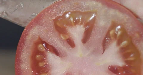 Macro wide close up of knife slicing and chopping a red tomato salad, food, Stock Footage 273513305