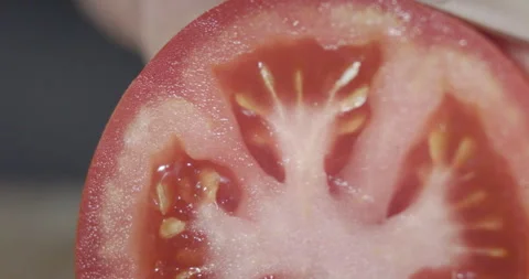 Macro wide close up of knife slicing and chopping a red tomato salad, food, Stock Footage 273513309