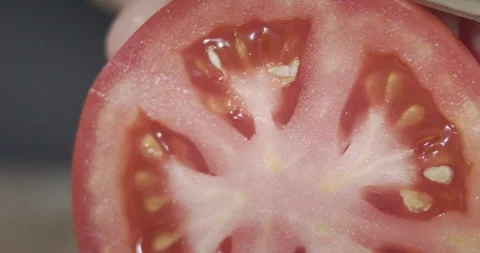 Macro wide close up of knife slicing and chopping a red tomato salad, food, Stock Footage 273513319