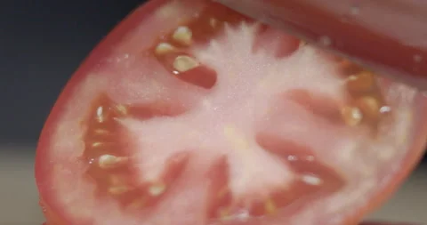 Macro wide close up of knife slicing and chopping a red tomato salad, food, Stock Footage 273513349
