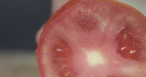 Macro wide close up of knife slicing and chopping a red tomato salad, food, Stock Footage 273513362