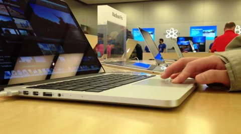 Macro woman browsing website in apple store on coquitlam center mall Stock Footage 37990581