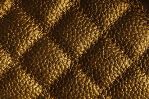 Macro of yellow quilted leather texture background with stitched pattern an.. Stock Photos