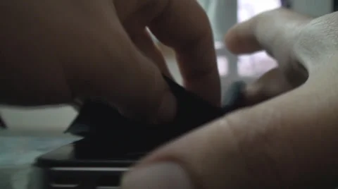 Macro Of A Young Man Cleaning His Smartphone Point Of View-Shot Stock Footage 34045475