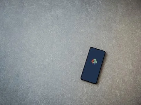 MacroDroid app launch screen on smartphone on ceramic stone background Stock Photos