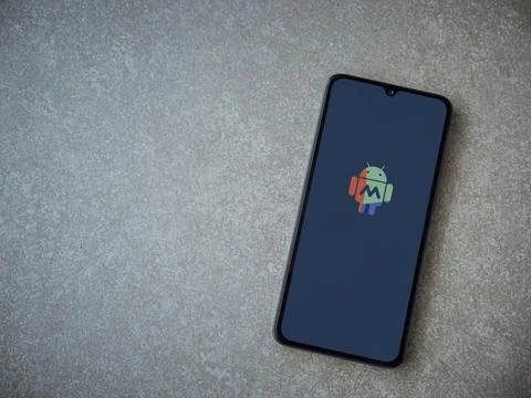 MacroDroid app launch screen on smartphone on ceramic stone background Stock Photos