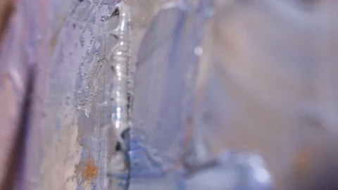 Macroplan of putting oil paints with spatula. mixing and laiding some paint on Stock Footage 201388991