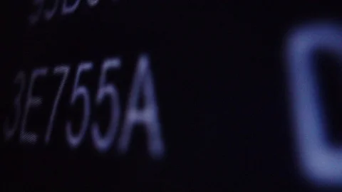 Macroscopic view of moving hexadecimal code matrix on LCD computer screen Stock Footage 111437009