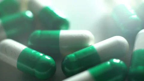 Macroshot of edical pills production. Capsules and pills close up. Stock Footage 147319772