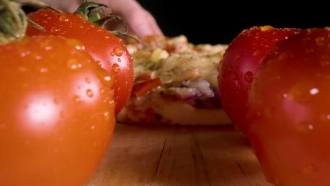 Macroshot of tasty pizza slice being lifted by a hand Stock Footage 126957054