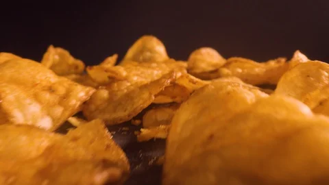 Macroshot of tortilla chips on black background Stock Footage 128943323