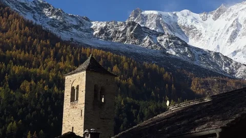 Macugnaga, Italy. Bell tower and glacier in the background. Alps with Monte Rosa Stock Footage 320558359