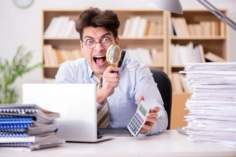 Mad auditor looking for errors in the report 写真素材