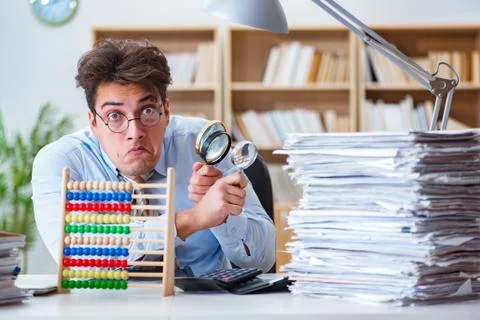 Mad auditor looking for errors in the report 스톡 사진