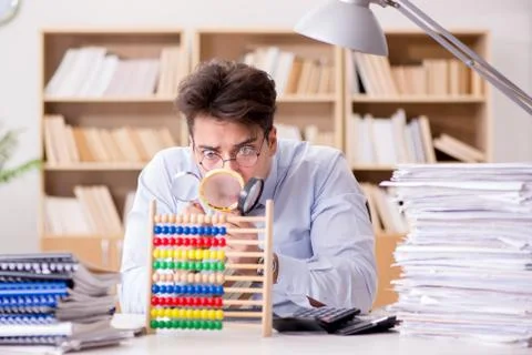 Mad auditor looking for errors in the report 스톡 사진