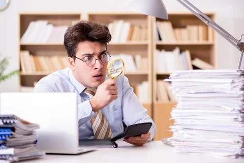Mad auditor looking for errors in the report Stock Photos