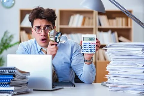 Mad auditor looking for errors in the report 스톡 사진