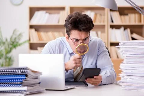 Mad auditor looking for errors in the report Stock Photos