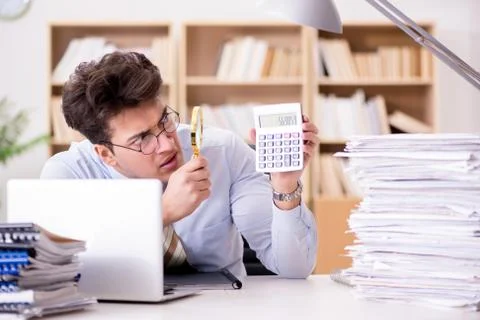 Mad auditor looking for errors in the report Stock Photos