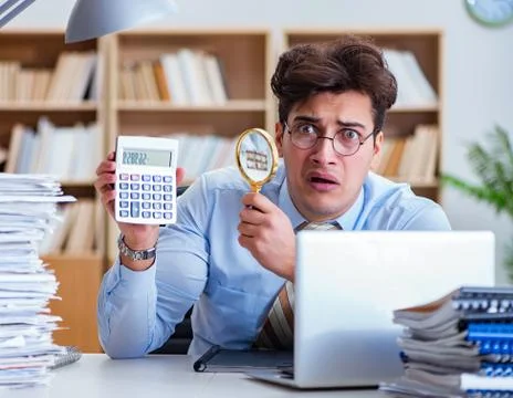 Mad auditor looking for errors in the report Stock Photos