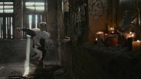 Mad Clown Performing Evil Dance inside Building with Shabby Walls Stock Footage 250942180