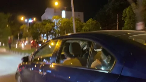 Mad driver trying to overtake a luxury car at night Stock Footage 162980945