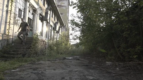 Mad hooligans gang with cold weapons runs to camera, gimbal shot, slow motion. Stock Footage 93845500