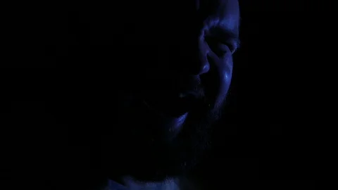 Mad insane crazy evil man laughing in darkness closeup. 4K UHD Vídeo Stock 73677512