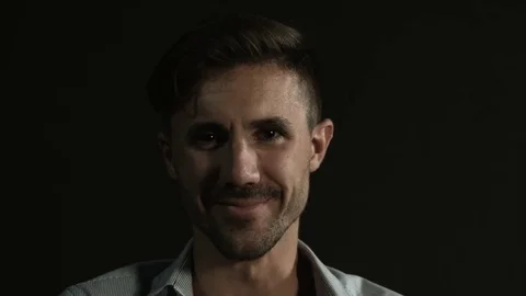 Mad insane crazy evil man laughing closeup on neutral black background Stock Footage 80303593