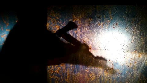 Mad killer committing bloody dissection with axe, brutal murder scene, thriller Stock Footage 82907641