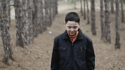 Mad laughing from a crazy kid in a forest Video stock 104708079