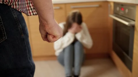 Mad man beating and threating young woman crying on floor. Concept of domestic Stock Footage 155681638
