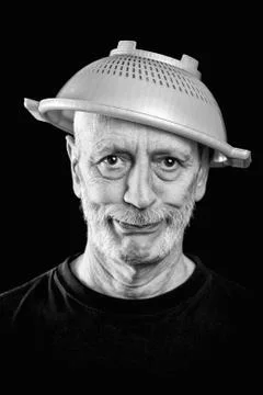 Mad man with a strainer on the head 스톡 사진