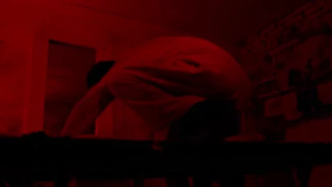 Mad man in straitjacket getting crazy in the cell of mental hospital and Stock Footage 159696505