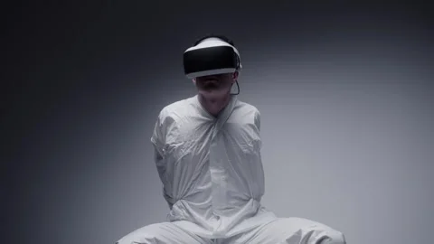 Mad Man in white coat with VR goggles against white background Stock-Footage 258543746