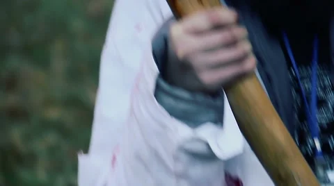 Mad woman with bloody murder weapon looking at victim, crazy maniac with axe Stock Footage 59083045