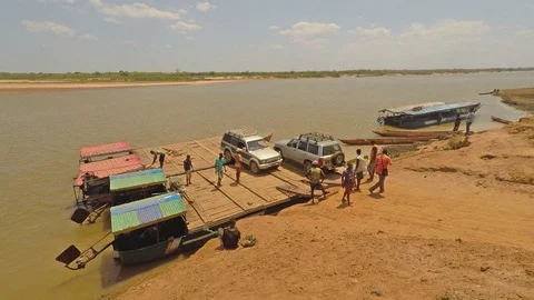Madagascar - 17 August 2016: Car unloading from ferry at Tsiribihina Stock Footage 90761312