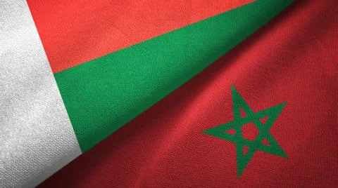 Madagascar and Morocco two flags textile cloth, fabric texture Stock Illustration