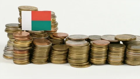 Madagascar flag waving with stack of money coins Video stock 71978511