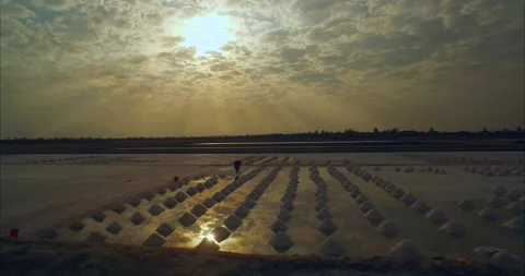 Madagascar Salt Plain Aerial Drone Shot Harvesting Mineral Piles at Sunset Stock Footage 338263223