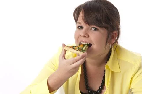 Mädchen isst eine Pizza Foto stock