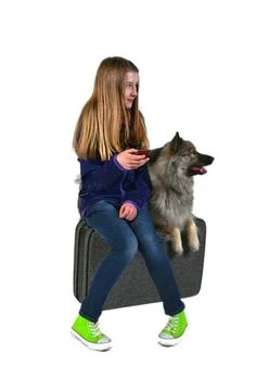 Mädchen mit Koffer und Hund cooles Mädchen Teenager ,model released, Symbo. Stock Photos