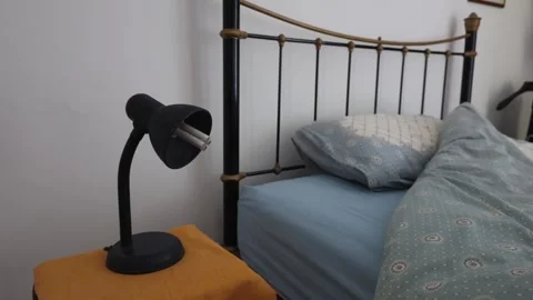 Made-Up Bed In Retro Style With A Lamp On The Side Stock Footage 293717987