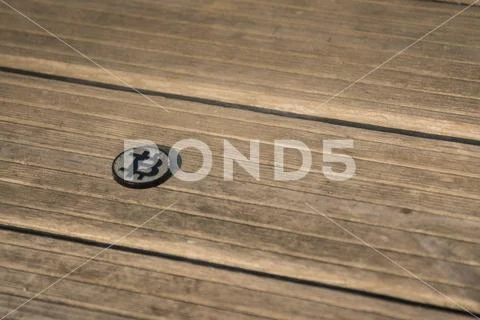 Made from black plastic custom bit coin on rustic old background Stock Photos