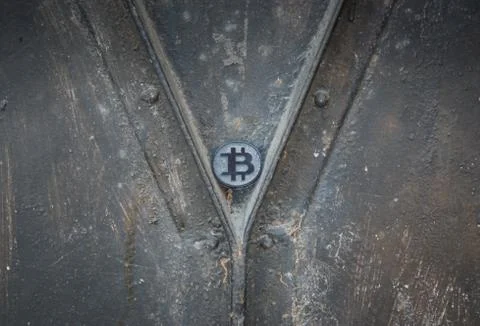 Made from black plastic custom bit coin on rustic old background Fotos de archivo