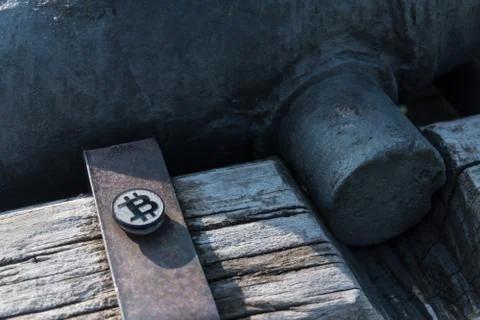 Made from black plastic custom bit coin on rustic old background Fotos de archivo