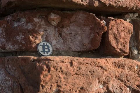 Made from black plastic custom bit coin in nature Fotos de archivo