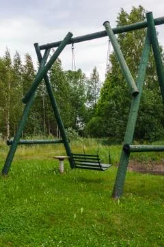 Made from wood, a large rustic swing for entertainment. Foto stock